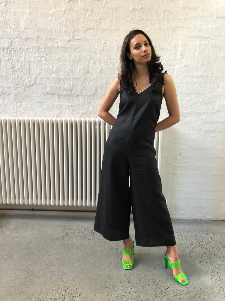 Ethically made black linen jumpsuit with adjustable shoulder tie.