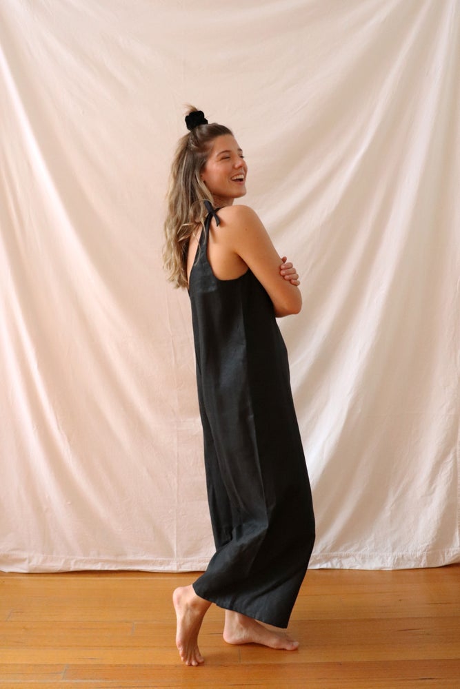 Ethically made black linen jumpsuit with adjustable shoulder tie.