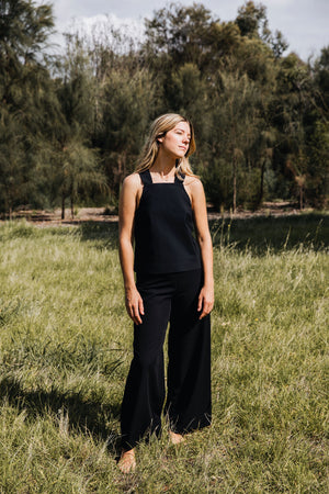 Ethically made black cotton stretch pants with wide leg and stretch waistband.